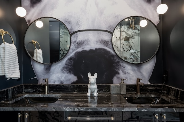 bathroom with a sink and double vanity