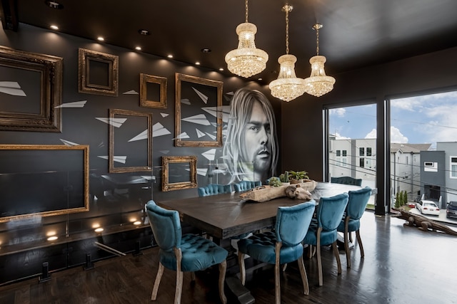 dining space featuring hardwood / wood-style flooring and an inviting chandelier