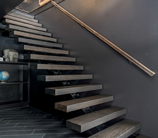 staircase with wood finished floors