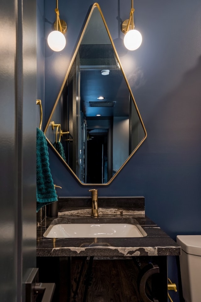 bathroom with vanity and toilet