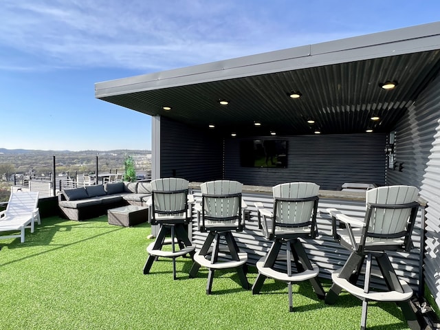 view of patio / terrace featuring an outdoor living space and a mountain view