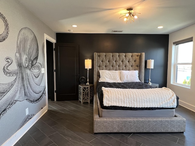 bedroom with wood finish floors, recessed lighting, and baseboards