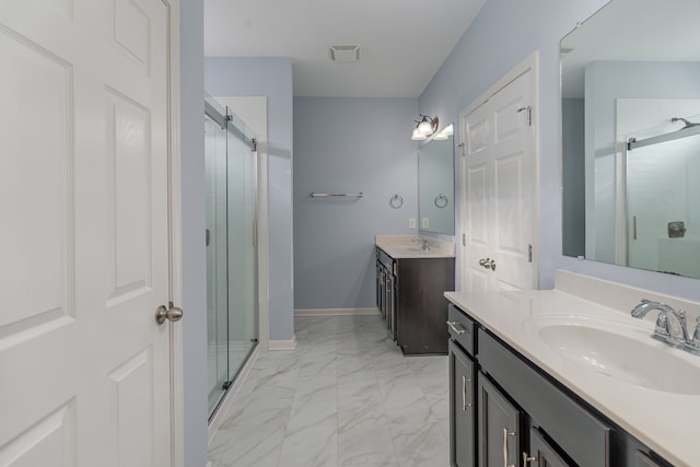 bathroom featuring vanity and an enclosed shower