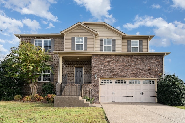 view of front facade with a front yard and a garage