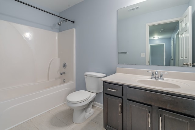 full bathroom featuring toilet, vanity, tile patterned floors, and shower / bathtub combination