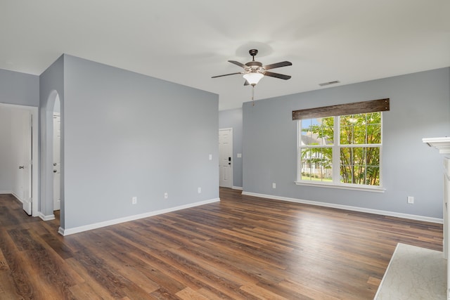 unfurnished room featuring ceiling fan and dark wood-type flooring