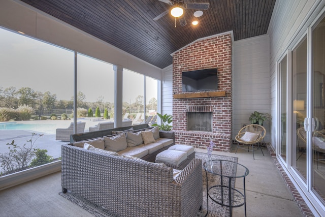 living room featuring concrete flooring, an outdoor brick fireplace, vaulted ceiling, ceiling fan, and wooden ceiling