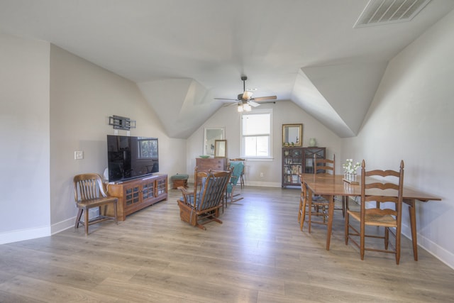 dining area featuring light wood-type flooring, ceiling fan, and lofted ceiling