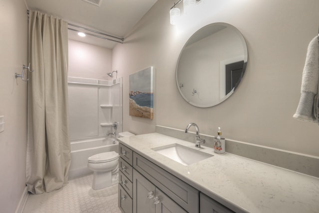 full bathroom with shower / bath combo, toilet, and vanity