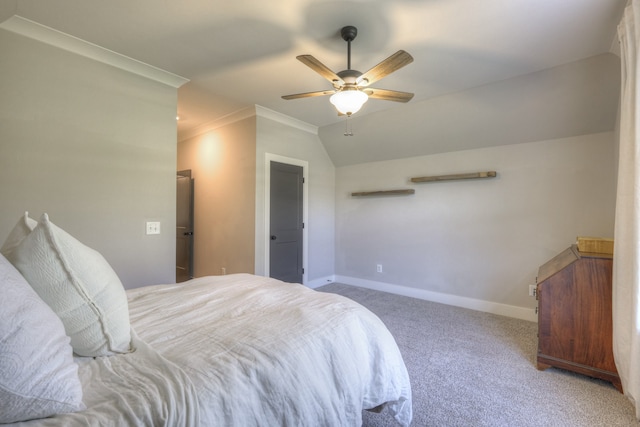 carpeted bedroom featuring ceiling fan and crown molding