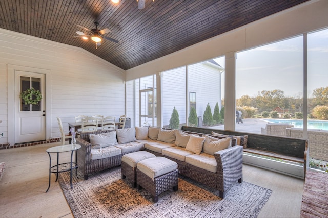 sunroom / solarium featuring vaulted ceiling, ceiling fan, and wooden ceiling