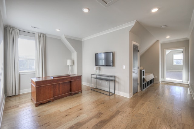 office area with light hardwood / wood-style flooring and crown molding