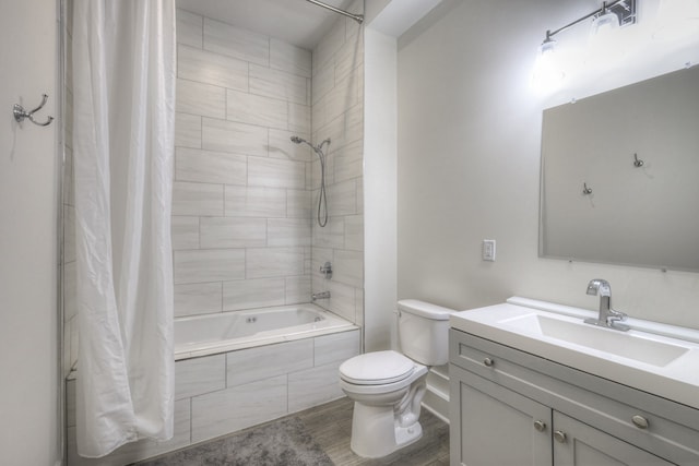 full bathroom featuring toilet, shower / tub combo with curtain, vanity, and hardwood / wood-style flooring