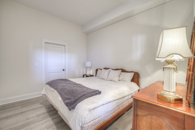 bedroom featuring wood-type flooring