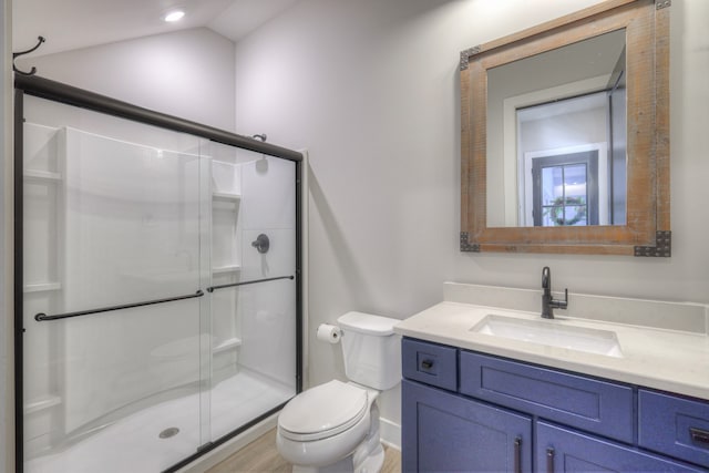 bathroom featuring an enclosed shower, vaulted ceiling, toilet, vanity, and hardwood / wood-style flooring