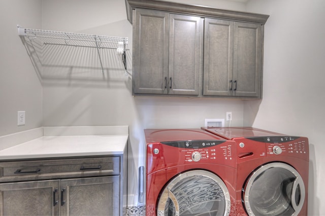 laundry area featuring cabinets and separate washer and dryer