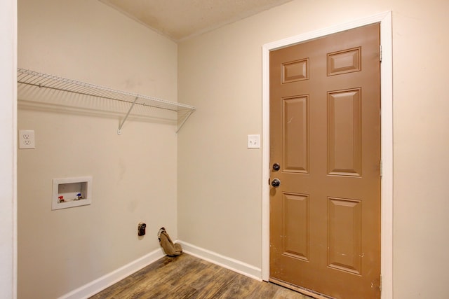 laundry room with dark hardwood / wood-style flooring and washer hookup