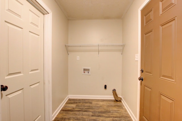 washroom featuring washer hookup, a textured ceiling, and dark wood-type flooring