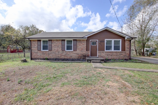 ranch-style home with a front yard