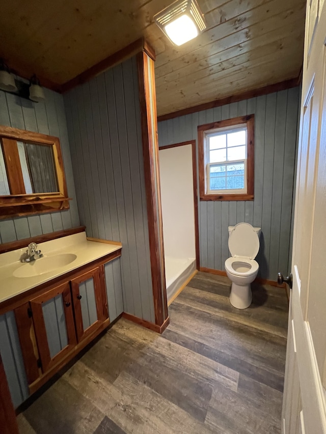 bathroom with wooden ceiling, hardwood / wood-style flooring, and wooden walls