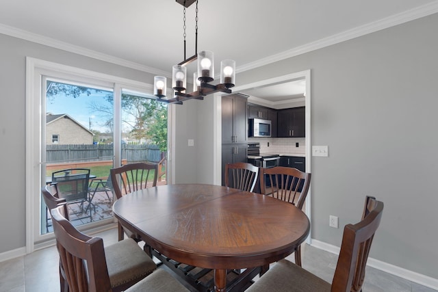 dining space featuring a notable chandelier, light tile patterned floors, and crown molding