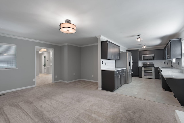 kitchen featuring sink, backsplash, crown molding, light colored carpet, and appliances with stainless steel finishes