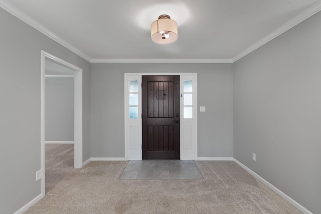 carpeted foyer featuring crown molding