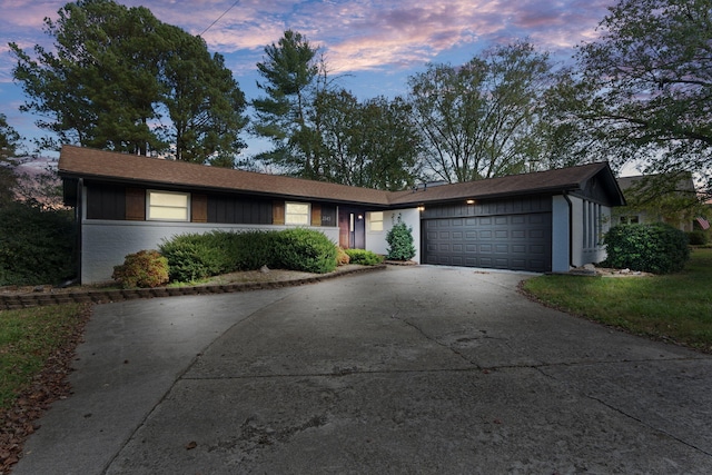 ranch-style home featuring a garage