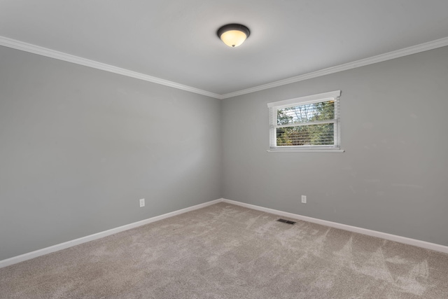 unfurnished room featuring carpet floors and ornamental molding