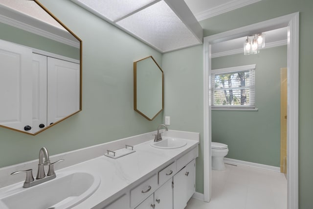 bathroom with vanity, tile patterned floors, crown molding, toilet, and a chandelier