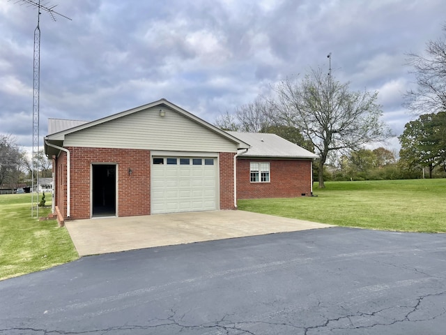 view of property exterior with a garage and a yard