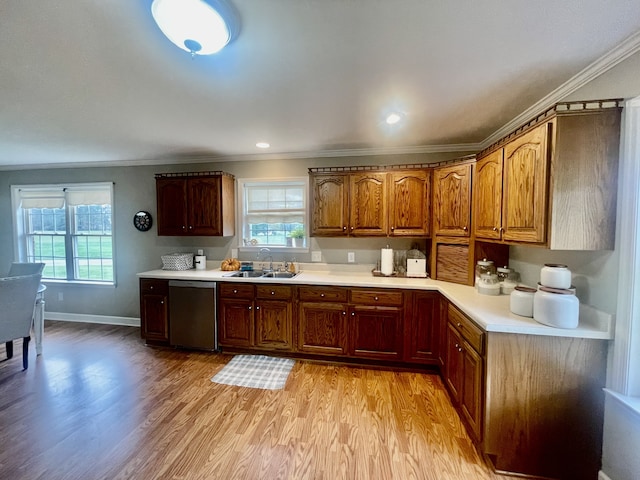 kitchen featuring dishwasher, light hardwood / wood-style flooring, and a wealth of natural light