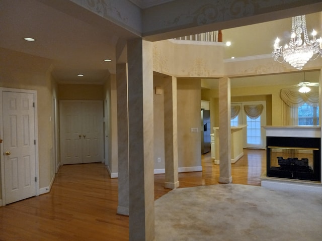 interior space with hardwood / wood-style floors and ornamental molding