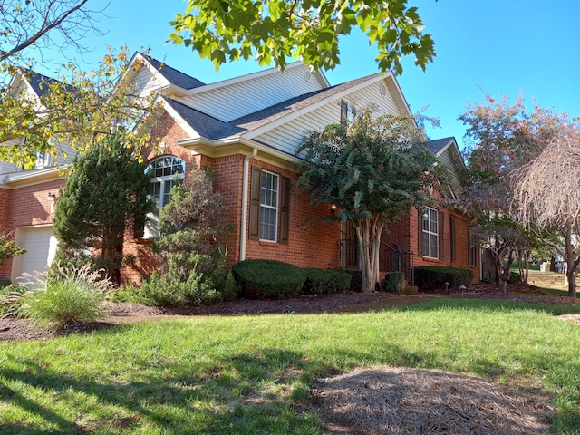 view of front of home with a garage and a front yard