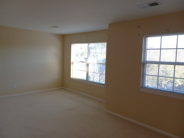 unfurnished room with carpet floors