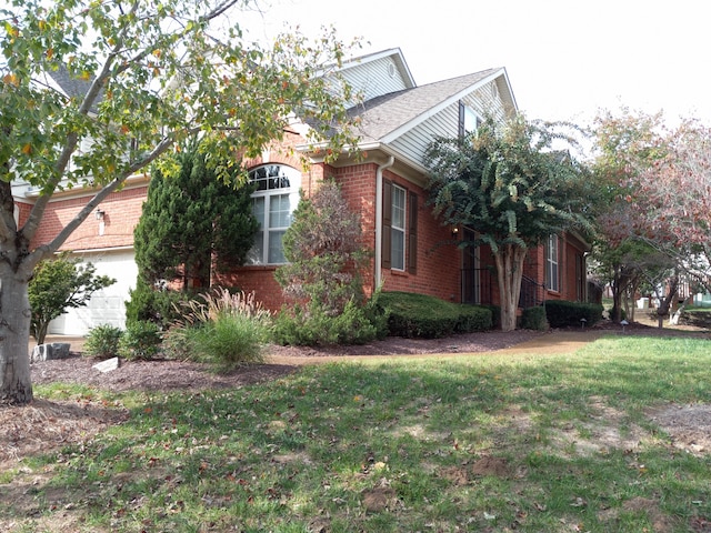 view of home's exterior featuring a yard