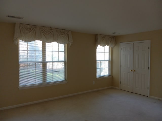 empty room featuring carpet flooring