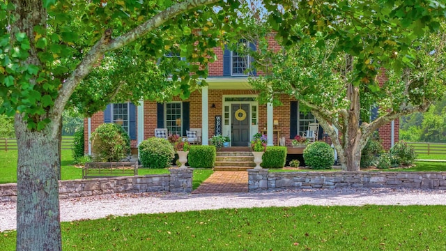 obstructed view of property featuring a porch