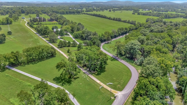 birds eye view of property featuring a rural view