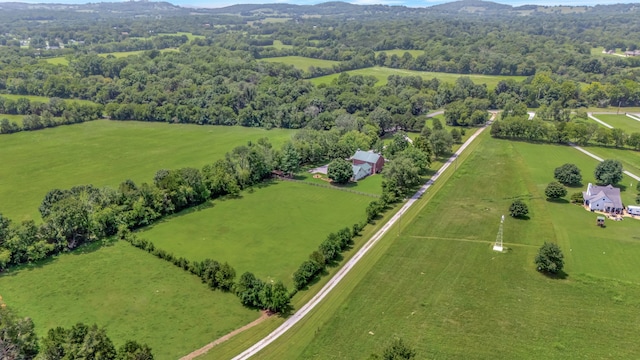 birds eye view of property with a rural view