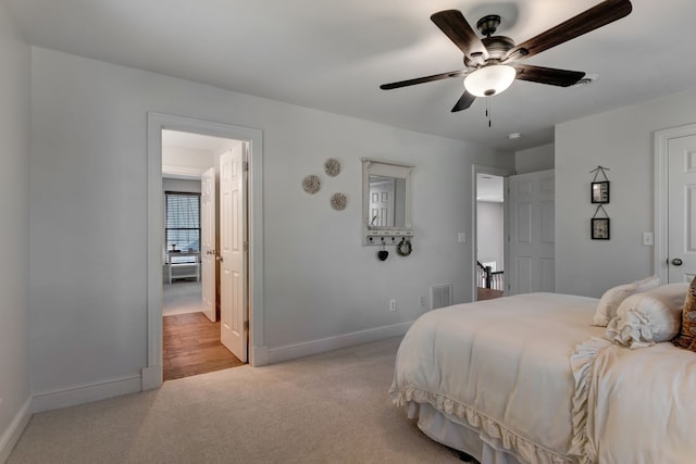 carpeted bedroom featuring ceiling fan