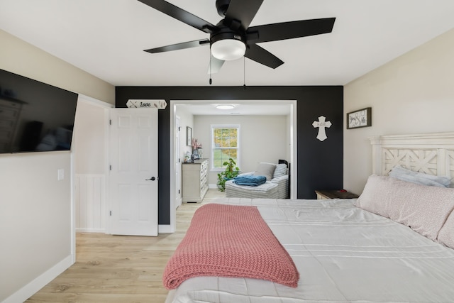 bedroom featuring ceiling fan and light wood-type flooring