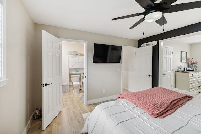 bedroom featuring ceiling fan, light hardwood / wood-style floors, and ensuite bathroom