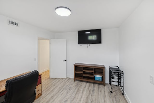 office area with light hardwood / wood-style floors