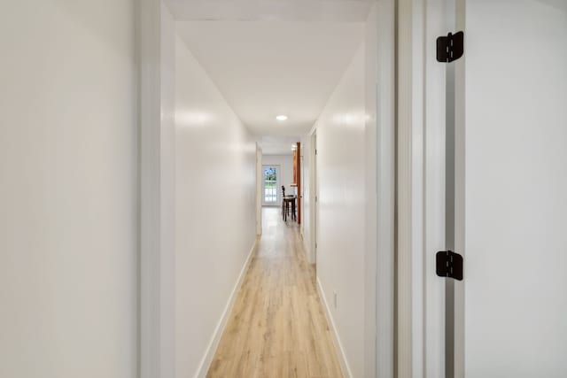 corridor featuring light hardwood / wood-style flooring