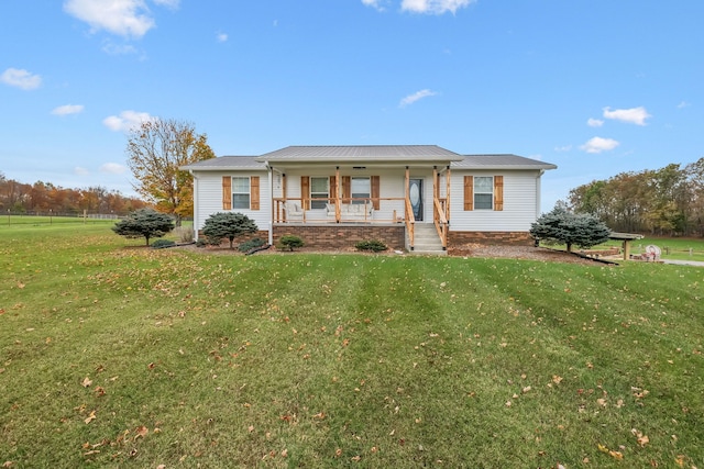 ranch-style house featuring a porch and a front yard