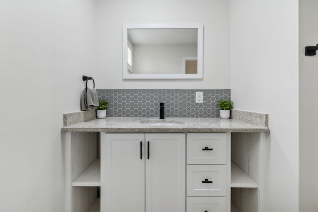 bathroom with backsplash and vanity