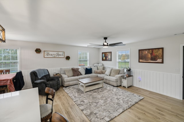 living room with ceiling fan and light hardwood / wood-style floors