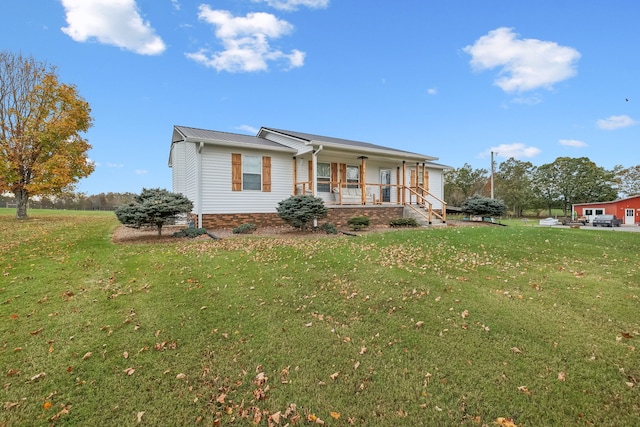 view of front of property with covered porch and a front lawn