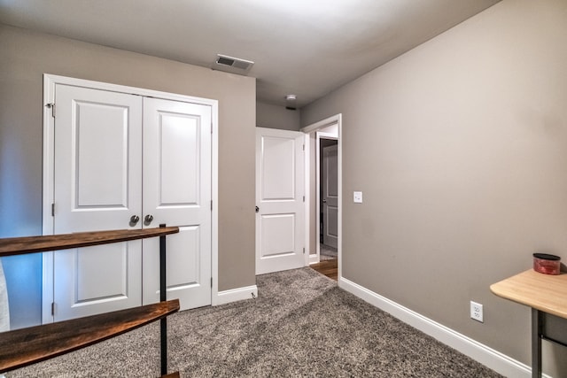 carpeted bedroom featuring a closet